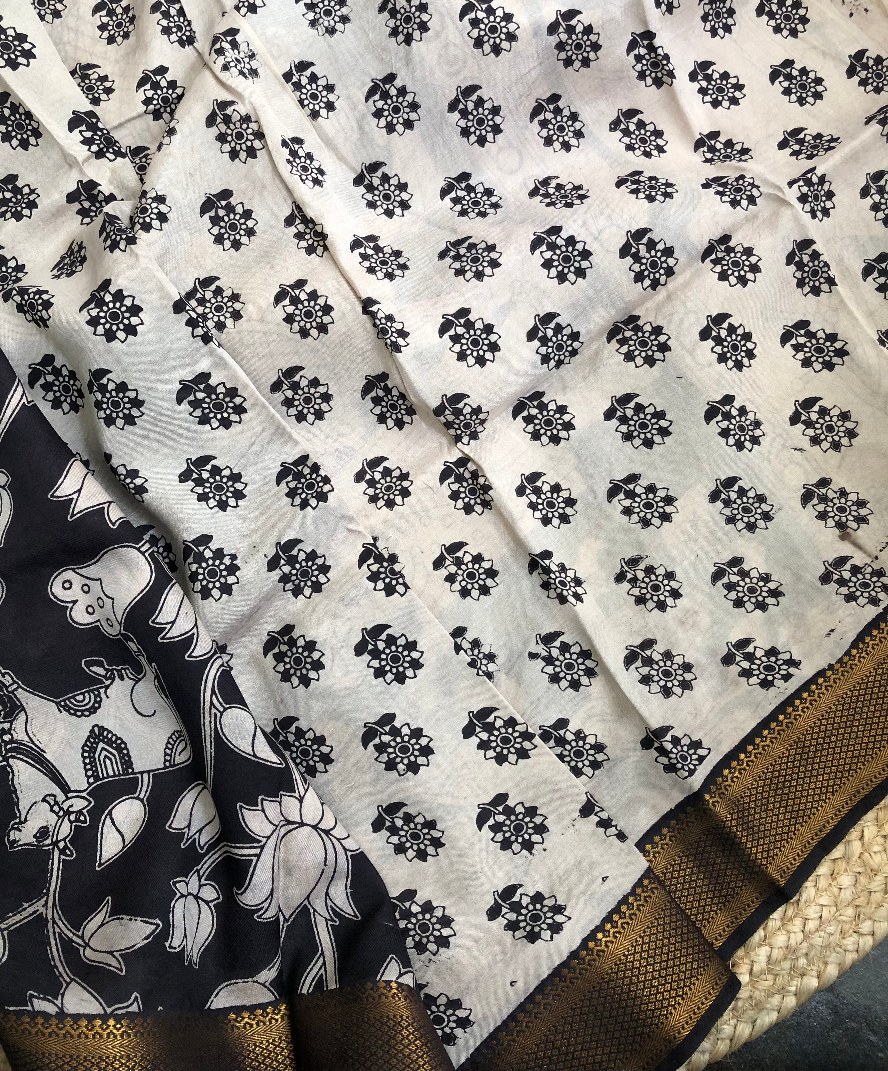 Tarathi off white Black lotus print kalamkari saree with Nizam Border